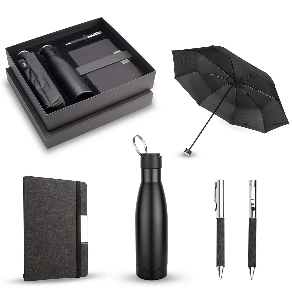 kit cuaderno, lapicero, un termo y un paraguas